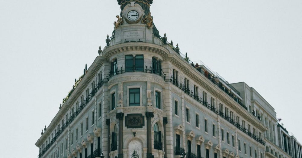 Four Seasons - A building with a clock on top of it