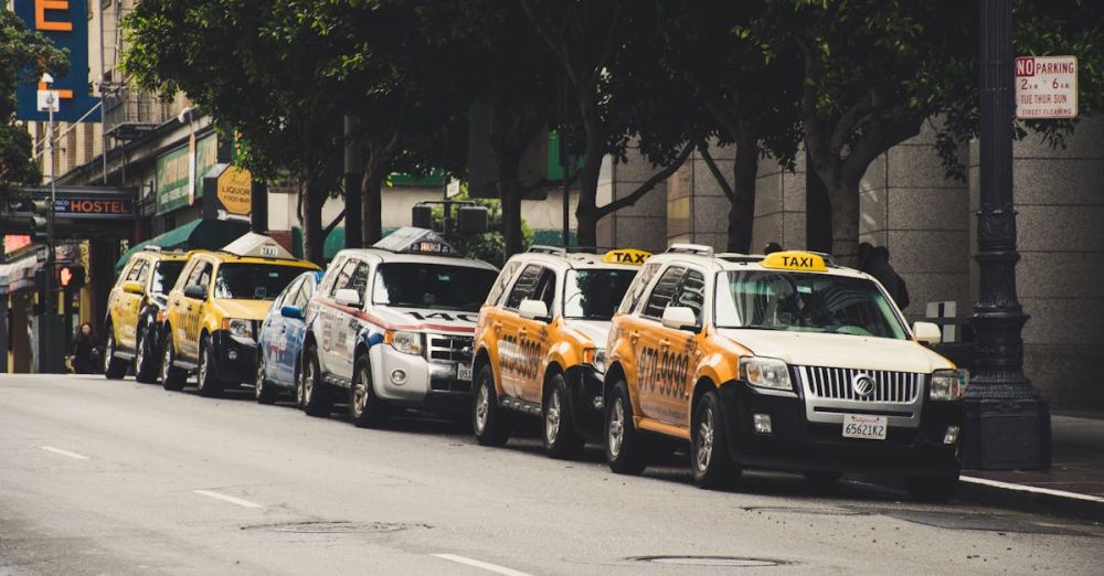 Taxis - Cars Parked Near Tree