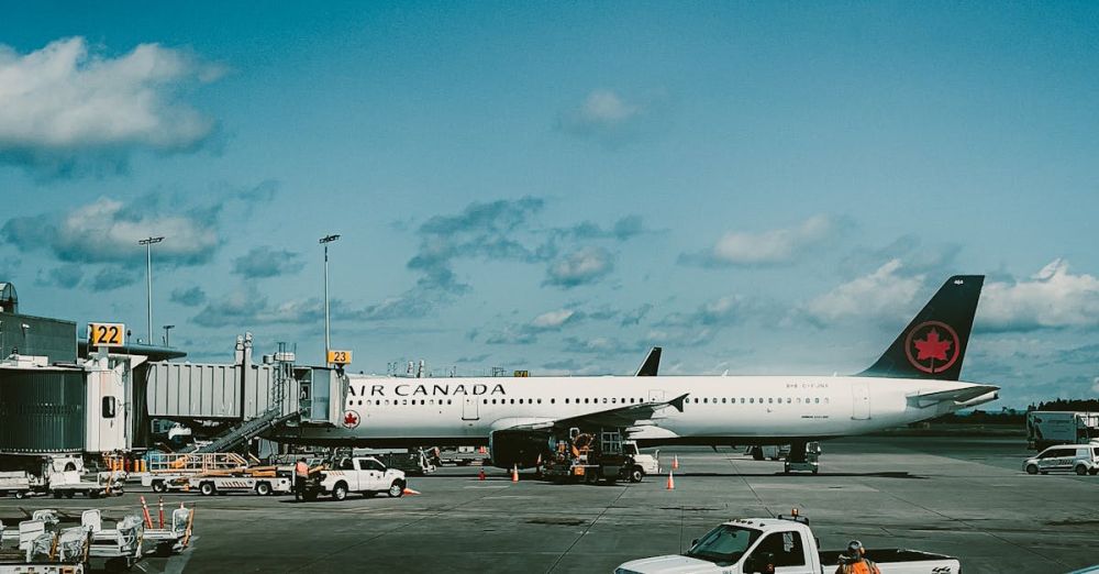 Airport Travel - A large airplane parked at an airport
