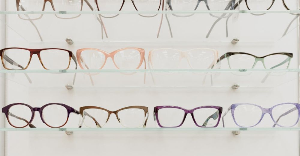 Glassware Markets - Stylish rims with lenses for vision arranged on glass shelves in ophthalmology salon