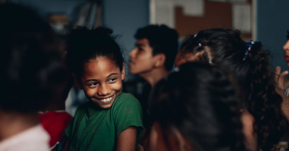 Theaters For Kids - Content African American girl in casual wear chatting with girlfriends while visiting spectacle