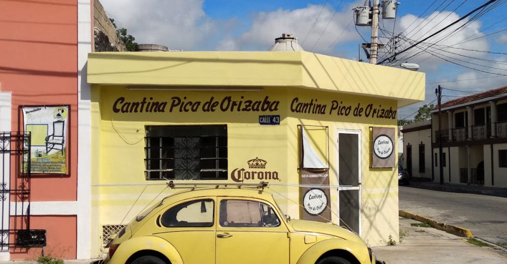 Cantina - Yellow Beetle Car Parked beside Yellow Building